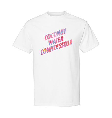 White Bretman Rock + Vita Coco T-shirt with the phrase "Bretman Rock, coconut water connoisseur" printed on the front in pink and purple lettering.