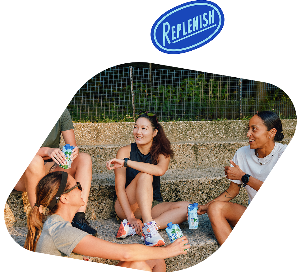 Friends drinking Vita Coco on steps