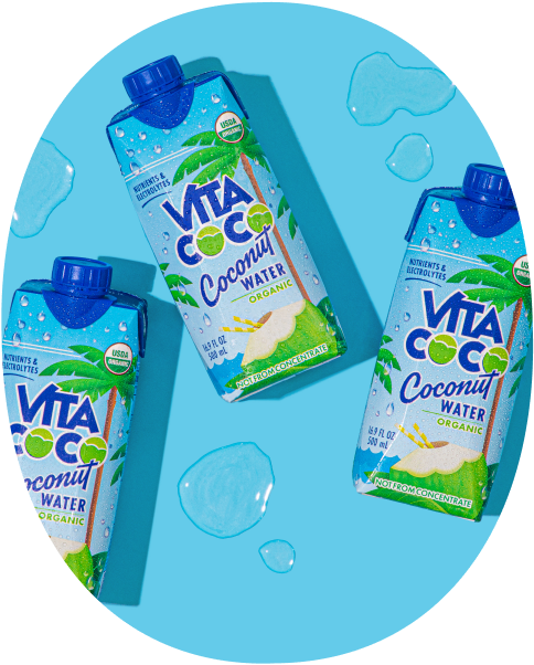 Three bottles of Vita Coco coconut water on a blue background.